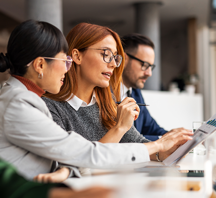 Professionals reviewing information together in an office